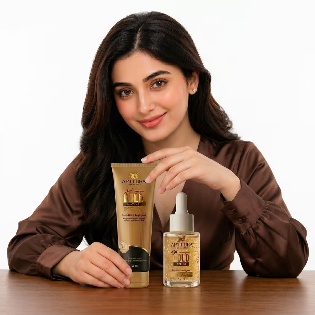 Woman holding a tube of Aptlura skincare product on a wooden table with a white background