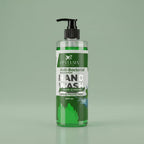 Bottle of Aptlura Naturals green and mint hand wash on a green background