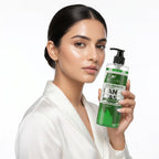 Woman holding a bottle of Aptlura hand wash against a white background