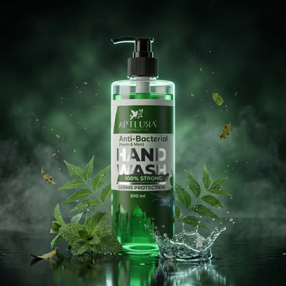 Green hand wash bottle with leaves on a dark green background