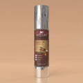 Argan oil hair serum bottle with silver cap on a beige background