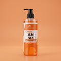 Bottle of Citrus Hand Wash on a peach background
