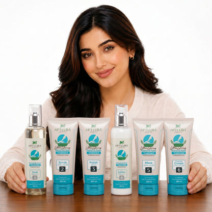 Woman holding a set of Aptlura skincare products on a white background