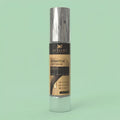 Keratox hair serum bottle with a green background
