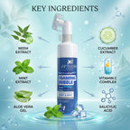 Foaming bubble wash bottle with key ingredients labeled on a blue background