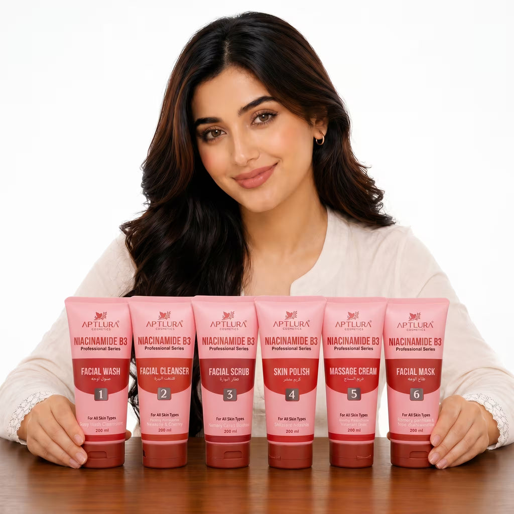 Woman holding six pink skincare products from Aptlura on a white background