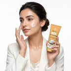 Woman applying cream to her face with a tube of Cretin Crema Rice Face Cream in the background.