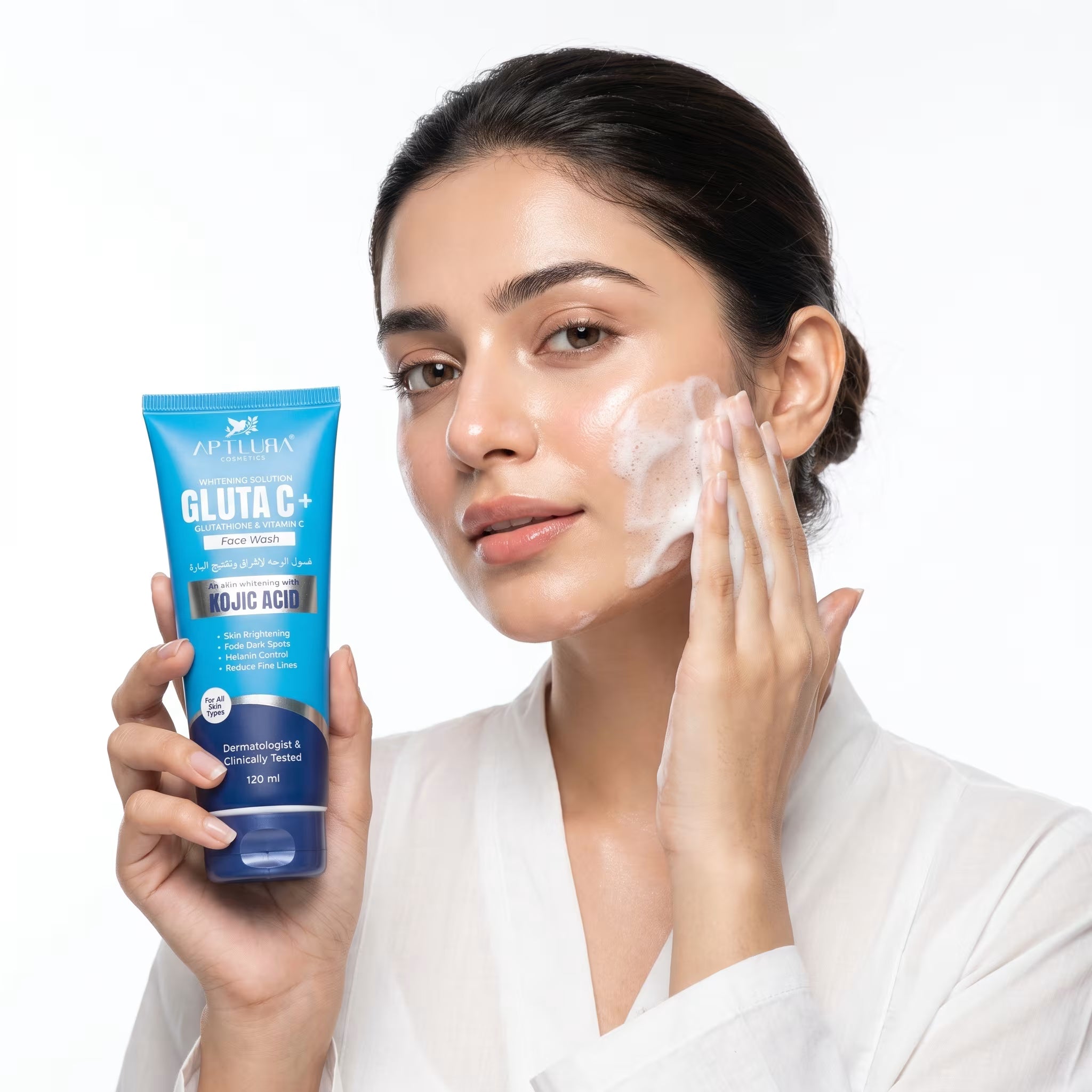 Woman applying skincare product to her face with a blue Gluta C+ tube in hand on a white background