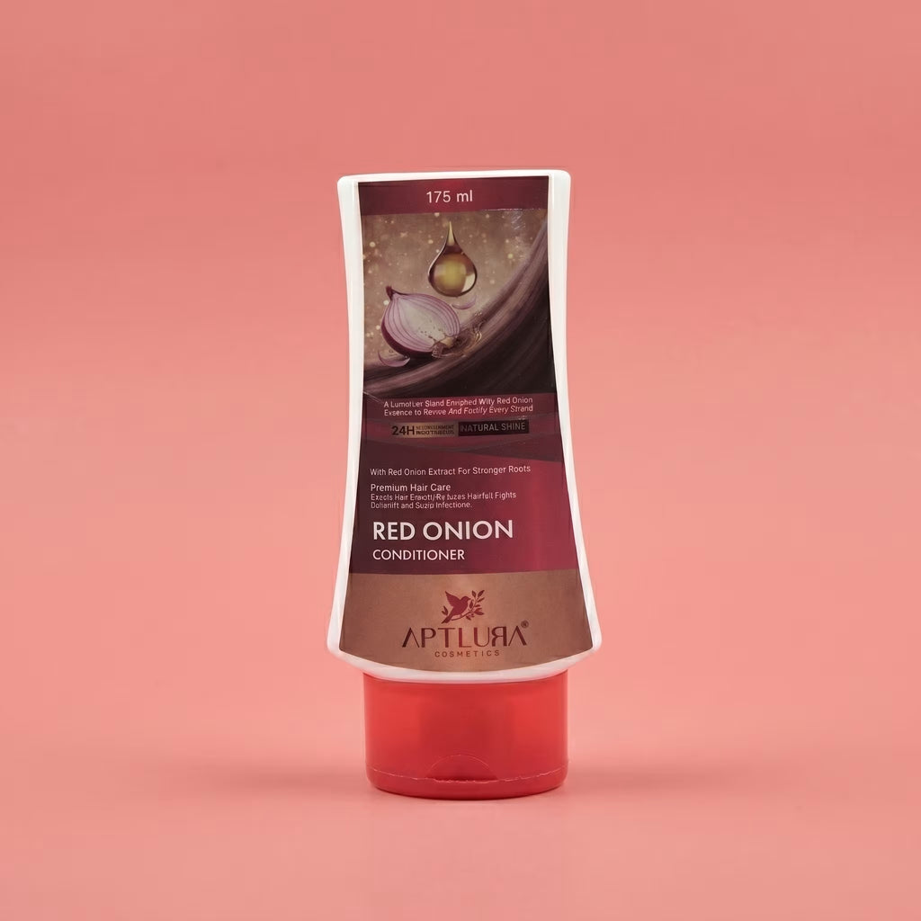 Red onion conditioner bottle with Aptlura branding on a pink background