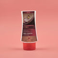 Red onion conditioner bottle with Aptlura branding on a pink background