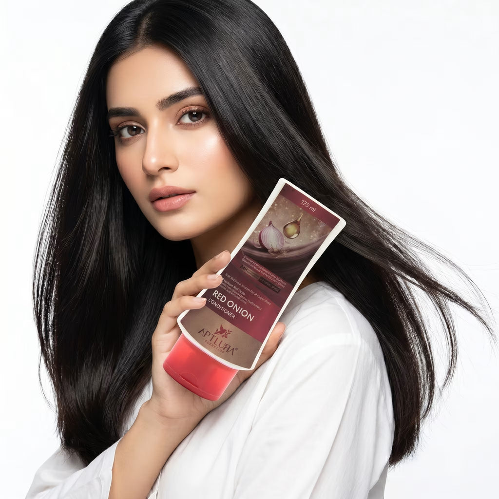 Woman holding a skincare product with a white background