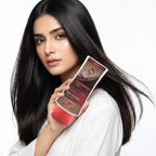Woman holding a skincare product with a white background