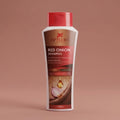 Aptlura Red Onion Shampoo bottle on a brown background