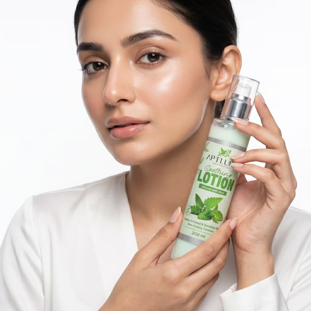 Woman holding a bottle of Aptlura lotion with a white background