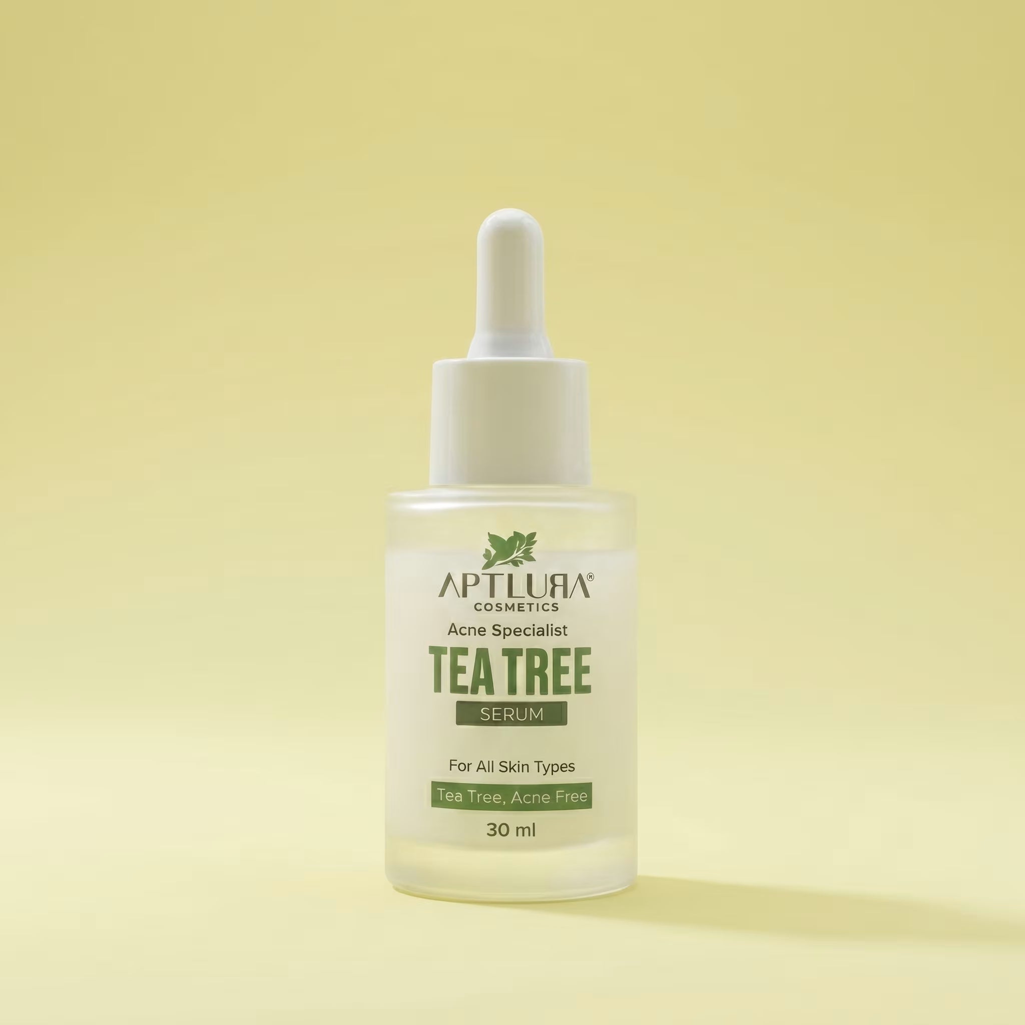 Tea tree serum bottle with dropper on a yellow background