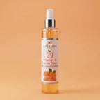 Vitamin C facial toner bottle with a label on an orange background