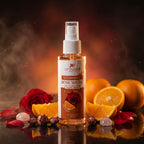 Bottle of Aptlura Vitamin C Rose Water Facial Toner with oranges and roses on a dark background