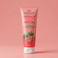Aptura Watermelon Face Wash tube on a pink background