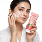 Woman applying cream to her face with a pink skincare product labeled 'Aptlura' in the background.