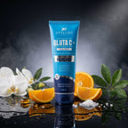 Blue tube of Aptlura Gluta C+ Face Wash with oranges and flowers on a reflective surface