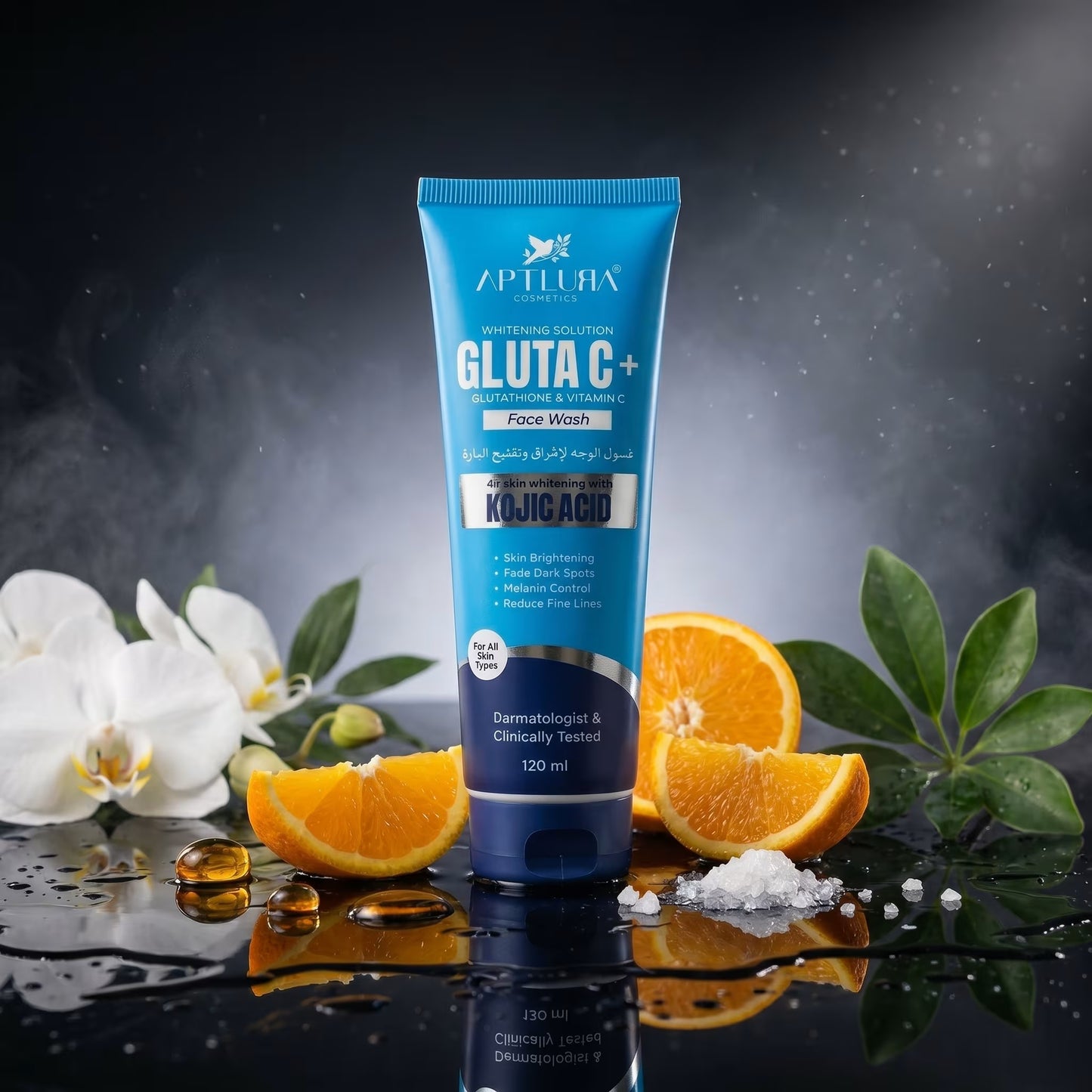 Blue tube of Aptlura Gluta C+ Face Wash with oranges and flowers on a reflective surface