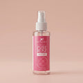 Bottle of Aptlura Pure Rose Water facial toner on a beige background