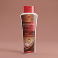 Aptlura Red Onion Shampoo bottle on a brown background