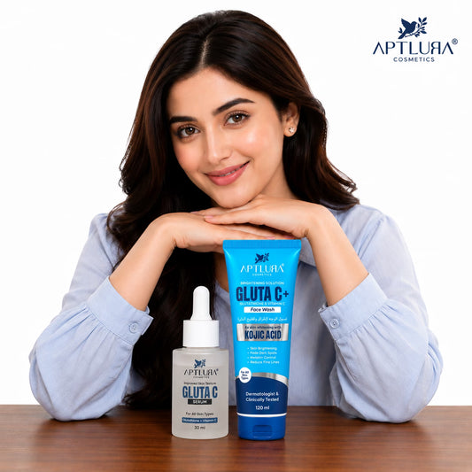 A woman in a light blue shirt poses behind two APTLURA COSMETICS Gluta C+ skincare products on a wooden table against a white background.