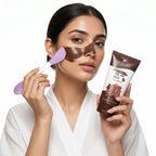 Woman applying coffee peel-off mask with brush and product packaging on a white background