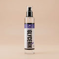 Clear spray bottle labeled 'Vegetable Glycerin' on a beige background