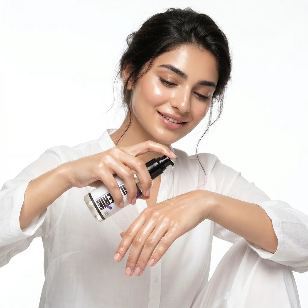 Woman applying a skincare product to her hand on a white background
