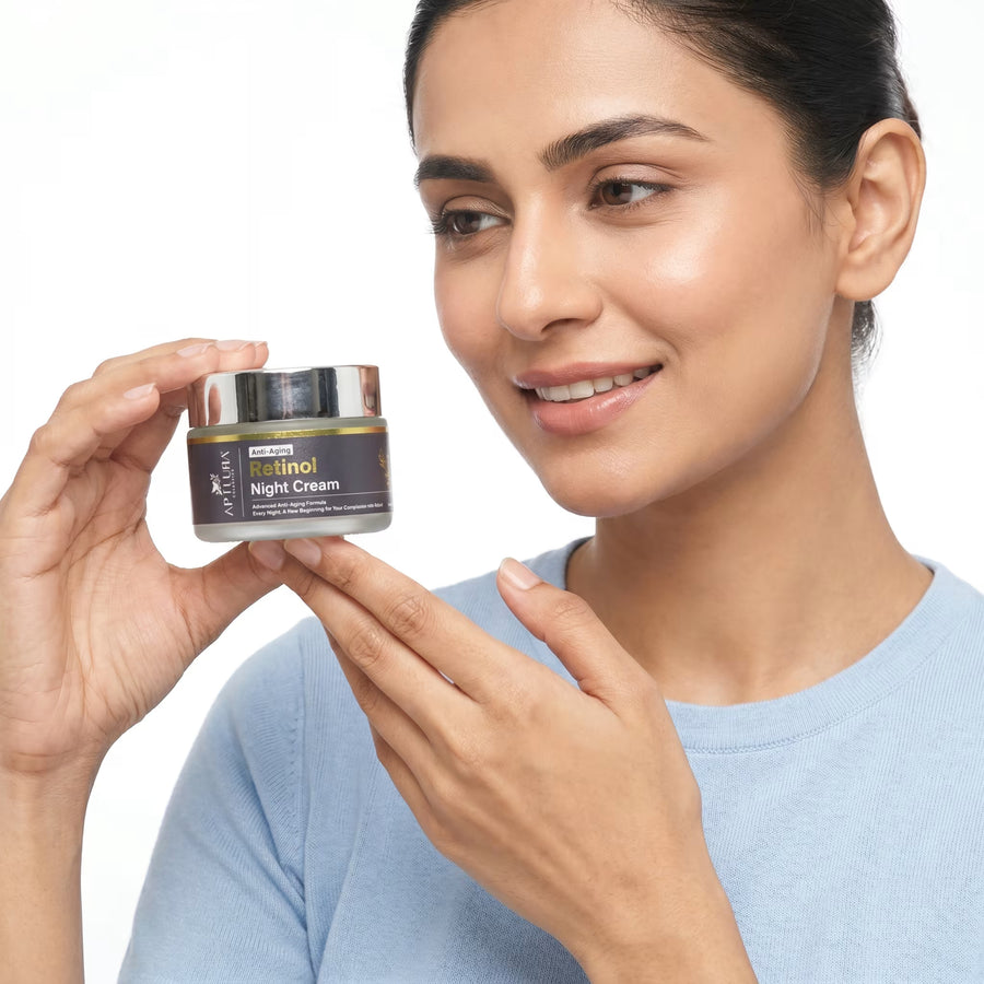 Woman holding a jar of night cream with a plain background