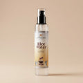 Aptlura Rice Water spray bottle on a beige background