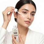 Woman applying a skincare product with a dropper to her face, holding a bottle labeled 'Retinol'.